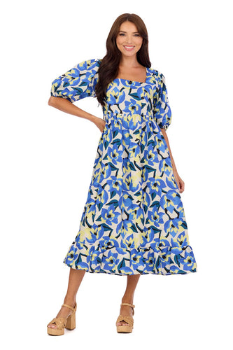 woman in long blue light yellow and white floral dress with puff sleeves
