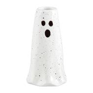 white vase shaped like a ghost with black eyes and mouth