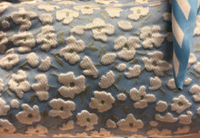 Load image into Gallery viewer, Close-up of floral fabric pattern on a blue background
