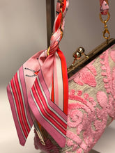 Load image into Gallery viewer, Pink handbag with a matching scarf draped over it
