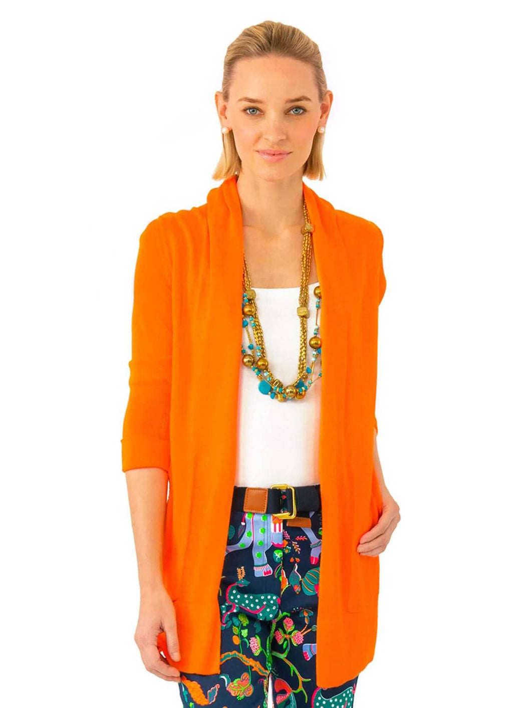 woman wearing Gretchen Scott Designs Open Cardigan Sweater with white top and print pants