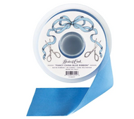 A spool of Hester & Cook Fancy China Blue Ribbon with a single ribbon tail unspooled, shown on a clean white background.