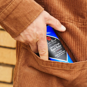 hand putting lube on Jack Black Industrial Strength Hand Healer in a pocket