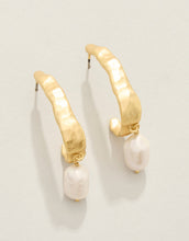 Load image into Gallery viewer, post earrings with a hammered gold half hoop set with a dangling pearl 
