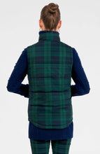 Load image into Gallery viewer, back view of a person wearing the Gretchen Scott Designs Puffer Vest Black Watch Plaid with navy sweater and matching pants
