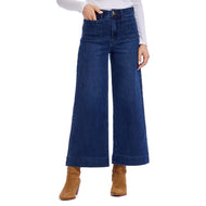 person wearing Jake Wide Leg Pants, wide leg blue jeans with white shirt and brown boots