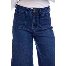 Load image into Gallery viewer, person wearing Jake Wide Leg Pants, wide leg blue jeans with white shirt, close up on waist showing small front pockets and large button
