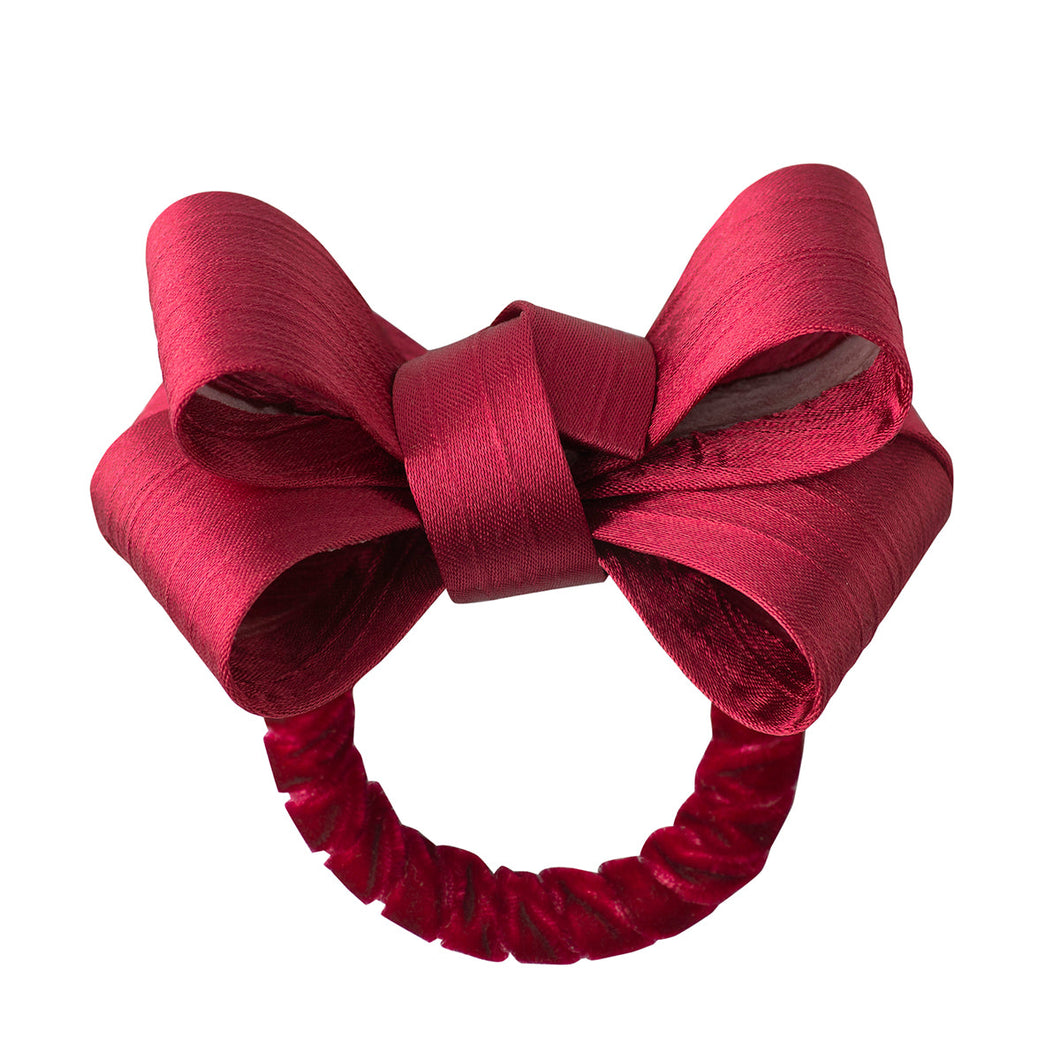 red napkin ring with a bow