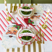 Load image into Gallery viewer, banner with the red script text Merry Christmas on a gold and white place settings
