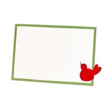Load image into Gallery viewer, white card with a green border and a red bird on the lower right corner 
