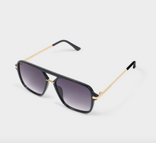 Load image into Gallery viewer, A pair of aviator-style sunglasses with a glossy black frame, gradient gray lenses, and slim gold metal temples, shown on a light gray background.
