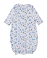 white Convertible gown printed with blue whales and with snaps forming gown