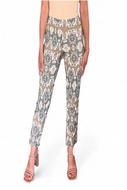 Floral patterned pants worn by a person on a white background