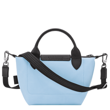 Load image into Gallery viewer, Longchamp Le Pliage Energy X-Small Top Handle Bag in sky blue back view showing light blue bag with black and silver accents 
