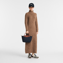 Load image into Gallery viewer, person holding a Longchamp Le Pliage Original Top Handle Handbag - Small
