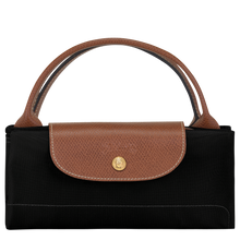 Load image into Gallery viewer, Longchamp Le Pliage Original Large Luggage Travel Bag  in black folded and snapped closed

