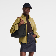 Load image into Gallery viewer, person holding a bag with the straps over her shoulder and the bag under her arm
