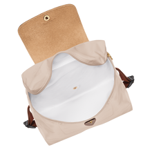 Load image into Gallery viewer, Longchamp Le Pliage Lid Medium Original Backpack in the color Paper with brown leather accents  open with white interior 
