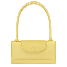 Load image into Gallery viewer, yellow bag with matching yellow leather center flap and shoulder straps folded

