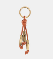key ring with orange leather and gold metal accents