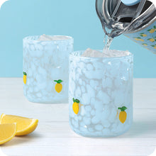 Load image into Gallery viewer, person pouring water into a Swig Summer Salt Charm Glass 17oz

