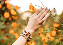 Load image into Gallery viewer, person wearing a Leopard Leather Cuff
