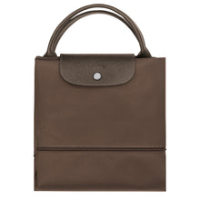 Load image into Gallery viewer, folded Longchamp Le Pliage Green Travel Bag Expandable in Terra brown canvas and matching leather accents and silver colored hardware
