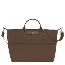 Load image into Gallery viewer, partly expanded Longchamp Le Pliage Green Travel Bag Expandable in Terra brown canvas and matching leather accents and silver colored hardware

