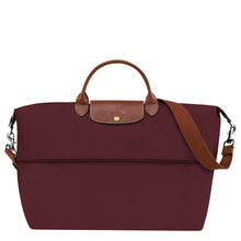 Load image into Gallery viewer, partly expanded Longchamp Le Pliage Green Travel Bag Expandable in Burgundy maroon canvas and brown leather accents and gold colored hardware
