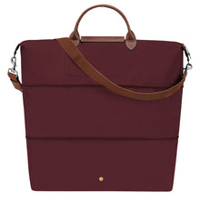 Load image into Gallery viewer, Fully expanded Longchamp Le Pliage Green Travel Bag Expandable in Burgundy maroon canvas and brown leather accents and gold colored hardware
