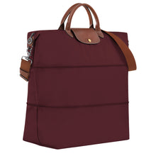 Load image into Gallery viewer, Fully expanded Longchamp Le Pliage Green Travel Bag Expandable in Burgundy maroon canvas and brown leather accents and gold colored hardware
