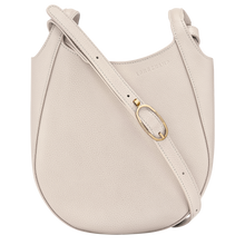 Load image into Gallery viewer, cream colored bag with short side handles  and cross body strap with gold buckle 

