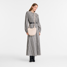 Load image into Gallery viewer, person wearing off white cross body bag
