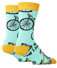 Load image into Gallery viewer, Light blue and orange socks with images of bicycles and the text This is how I ride
