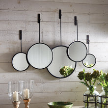 Load image into Gallery viewer, Five circular mirrors hanging on the wall 
