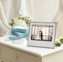 Load image into Gallery viewer, frame set next to stack of mariposa gift boxes
