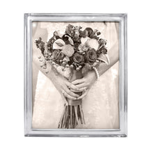 Load image into Gallery viewer, thin silver colored frame with a photo of a bride holding a bouquet 
