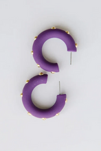 Load image into Gallery viewer, Purple semi-circular hoop earrings with small gold studs, shown on a plain light gray background.
