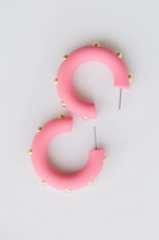 Load image into Gallery viewer, Pink curved hoop earrings with small gold studs, displayed on a clean white background.
