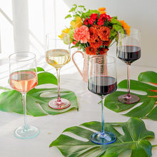 Load image into Gallery viewer, Mezclada Wine Glass filled on a table with flowers

