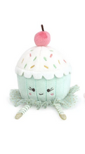 Load image into Gallery viewer, A cute plush cupcake toy with a mint green body, white frosting, colorful embroidered sprinkles, a pink cherry on top, and striped legs, shown on a plain white background.
