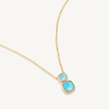 Load image into Gallery viewer, close up of two stone pendant showing facets of blue stone
