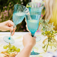 Load image into Gallery viewer, people using the Vietri Natalia Teal Water Glass to toast
