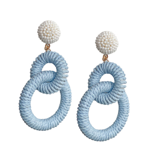 earrings with two pale blue colored Raffia loops dangling from a circle of tiny pearl beads
