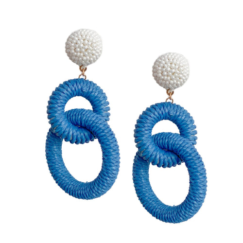 earrings with two loops of blue colored Raffia dangling from a circle of white pearl beads 