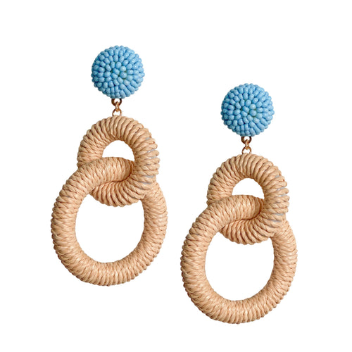 earrings with two loops of Natural colored Raffia dangling from a circle of tinypale blue colored beads 