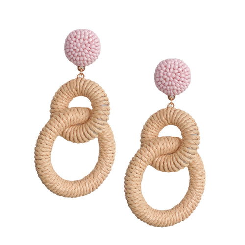 earrings with two loops of Natural colored Raffia dangling from a circle of pale pink colored beads 
