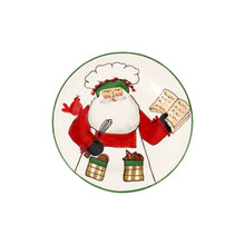 Load image into Gallery viewer, Vietri Old St. Nick 2025 Limited Edition Salad Plate Santa in a chef hat holding a whisk and reading from a book

