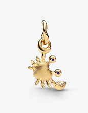 Load image into Gallery viewer, Gold crab charm with blue gemstones on a white background
