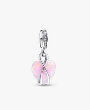 Load image into Gallery viewer, Silver charm with pink heart design on a white background
